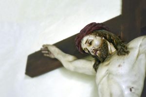 Detailed view of a crucifix statue depicting Jesus, located in Kietrz, Poland.